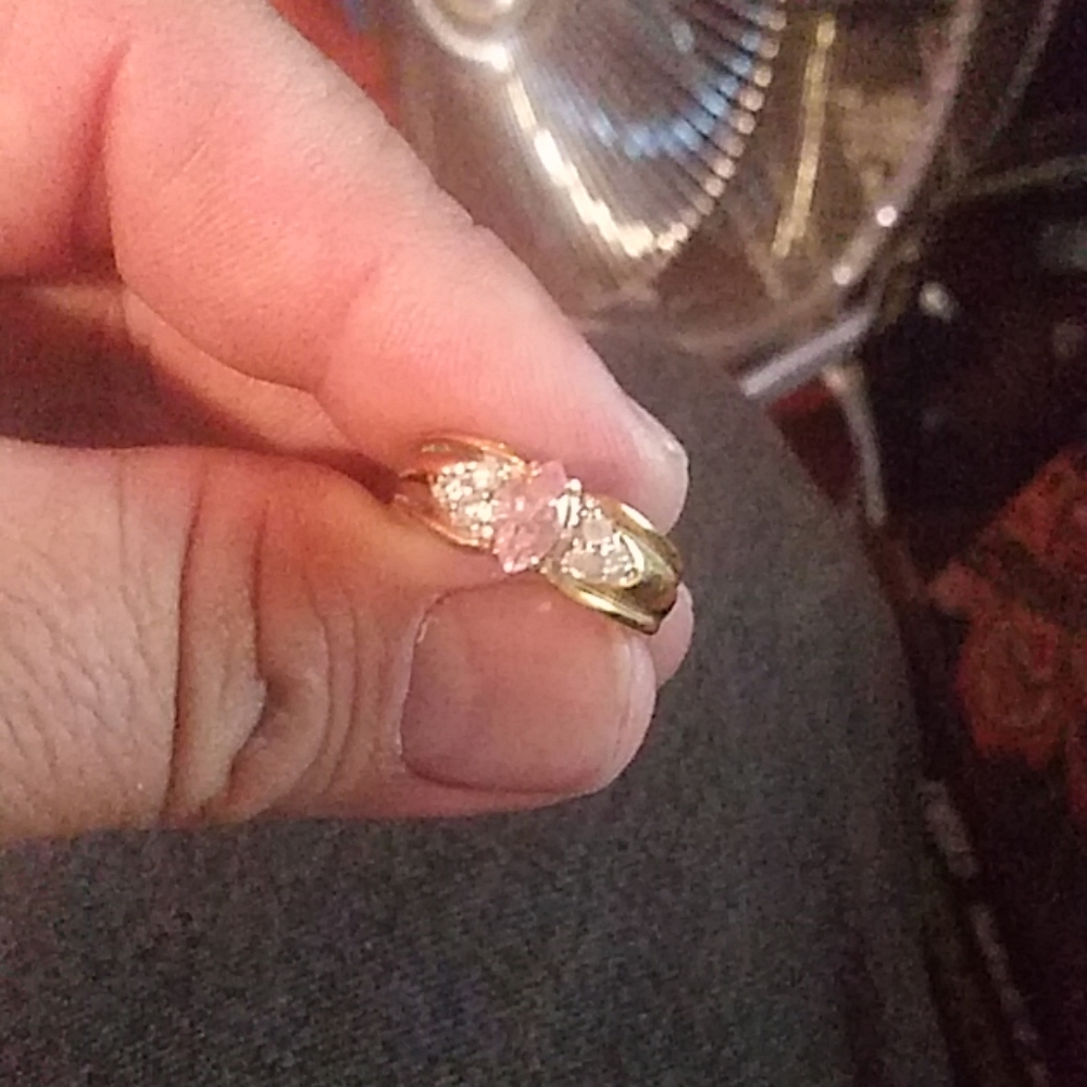 Ring with pink center stone